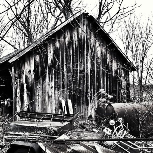 OLD BUILDING WITH TREES IN FOREGROUND