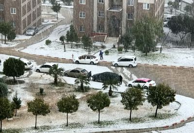 High angle view of cars on street during winter