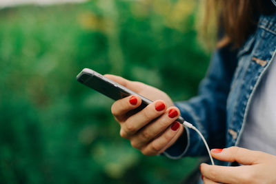 Close-up of woman using mobile phone