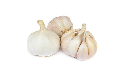 Close-up of pumpkins against white background