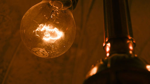 Close-up of illuminated light bulb