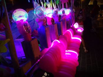 View of illuminated ferris wheel at night