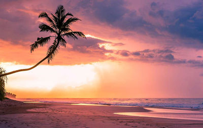 Scenic view of sea against sky at sunset