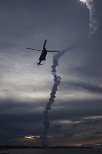 Low angle view of airplane flying in sky