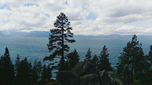 Scenic view of sea against cloudy sky