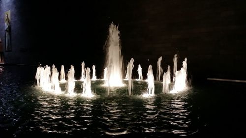 Panoramic view of illuminated water at night