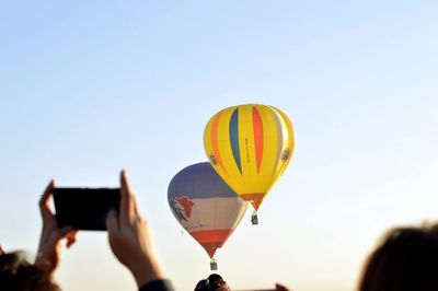 Hot air balloon flying against clear sky