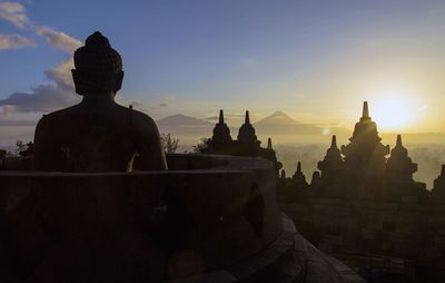 Statue of temple at sunset