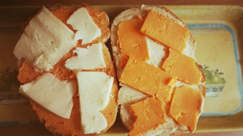 Close-up of bread with cheese slices on table