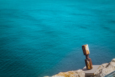 High angle view of rocks by sea