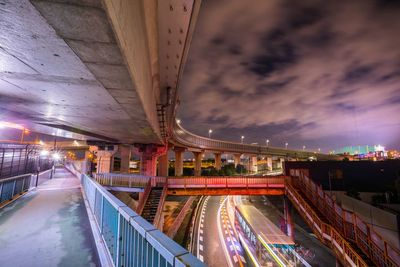 Panoramic view of bridge in city against sky at night