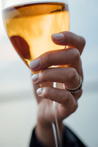 Close-up of hand holding drink