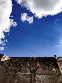 Low angle view of built structure against blue sky