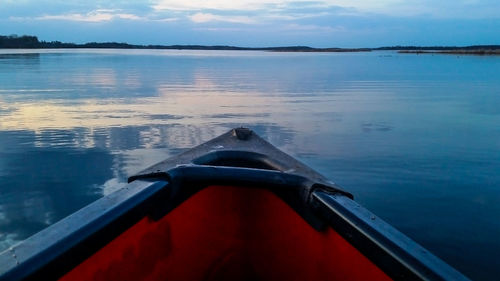 Boat in lake against sky