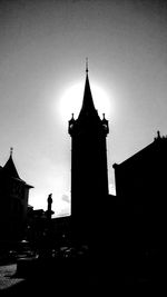 Low angle view of silhouette tower against sky