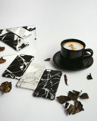 High angle view of coffee on table against white background