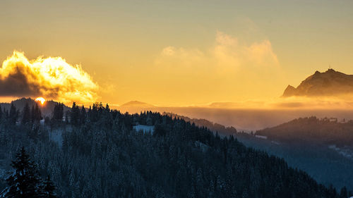 Panoramic view of mountains against sky during sunset