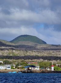 Scenic view of sea and mountains against sky