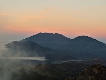 Scenic view of mountains against sky during sunset