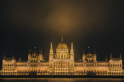 Illuminated hungarian parliament  against sky at night