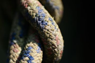 Close-up of rope against black background