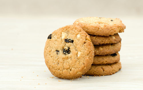 Close-up of cookies stacked on table