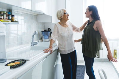 Women standing at home