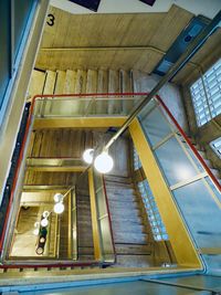 Low angle view of illuminated pendant lights in building