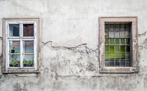 The old dilapidated wooden window frame.