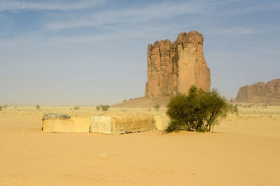 Rock formations in desert against sky