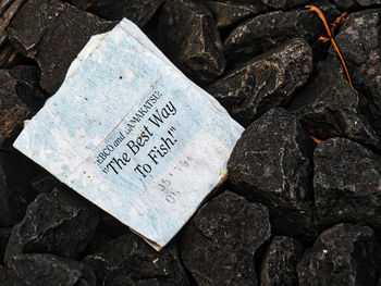 High angle view of text on rocks