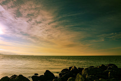 Scenic view of sea against sky during sunset