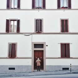 Woman in front of building