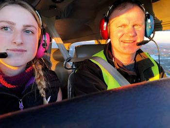 Portrait of smiling woman sitting in car