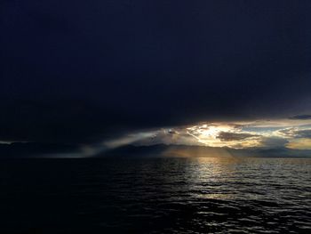 Scenic view of sea against sky at night