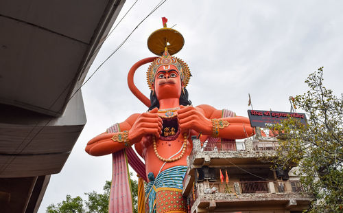 Big statue of lord hanuman near the delhi metro bridge situated near karol bagh, delhi, india