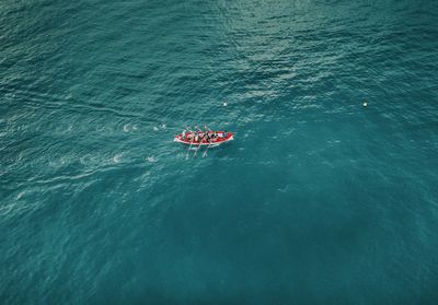 High angle view of people boating on sea