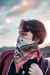 Portrait of woman against sky during winter