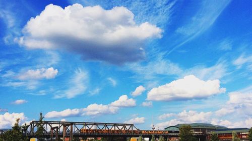 Built structure against blue sky and clouds