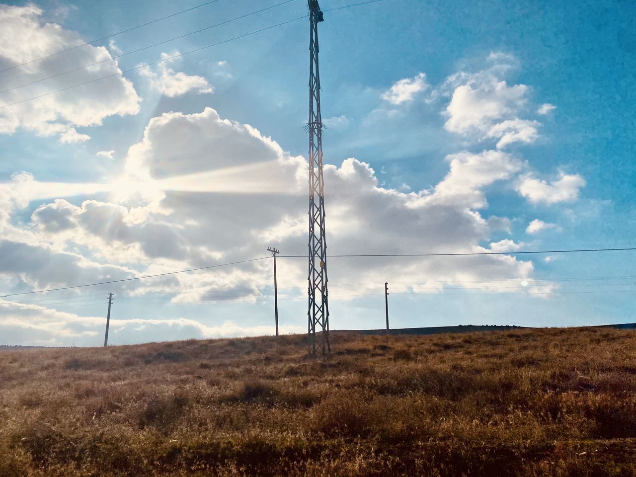 LOW ANGLE VIEW OF ELECTRICITY PYLON ON LAND