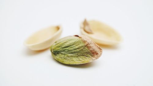 Close-up of fruits against white background