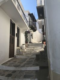 Empty alley amidst buildings in city