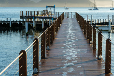 Pier over sea against sky