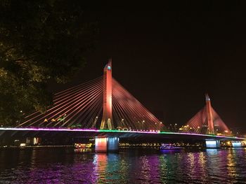 Bridge over river at night