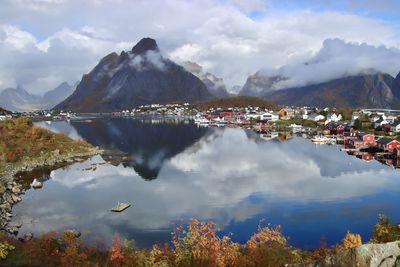 Scenic view of lake and mountains against sky