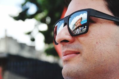 Close-up portrait of man wearing sunglasses