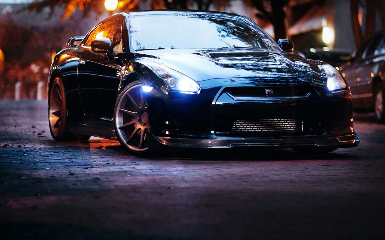 transportation, land vehicle, mode of transport, car, street, focus on foreground, headlight, stationary, close-up, travel, illuminated, reflection, night, outdoors, road, selective focus, no people, parking, incidental people, parked