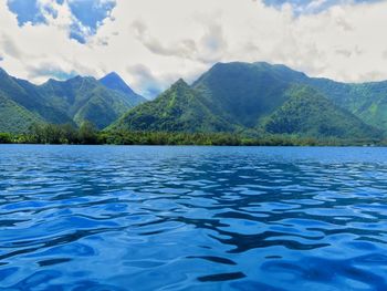 Scenic view of lake and mountains against sky