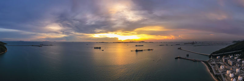 Panorama twilight seascape and silhouette tanker transport shipping open sea logistic