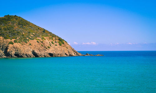 Scenic view of sea against blue sky